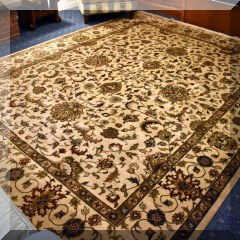 D08. Hand knotted cream and green rug. Small stain. 12' x 9' - $850